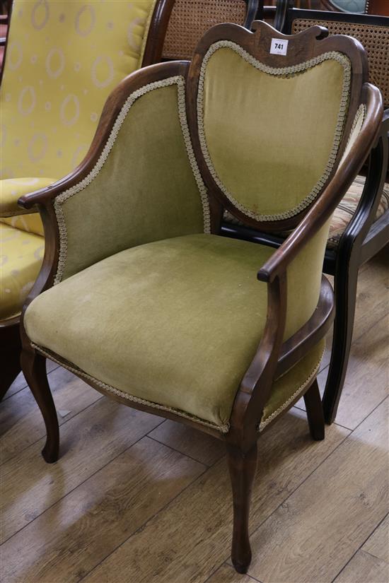 A late Victorian inlaid mahogany armchair, with shaped back